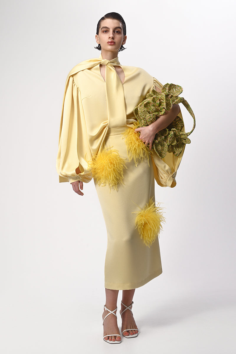 Lalo butter yellow midi pencil skirt with feather details, stylish and fitted, perfect for elegant occasions.