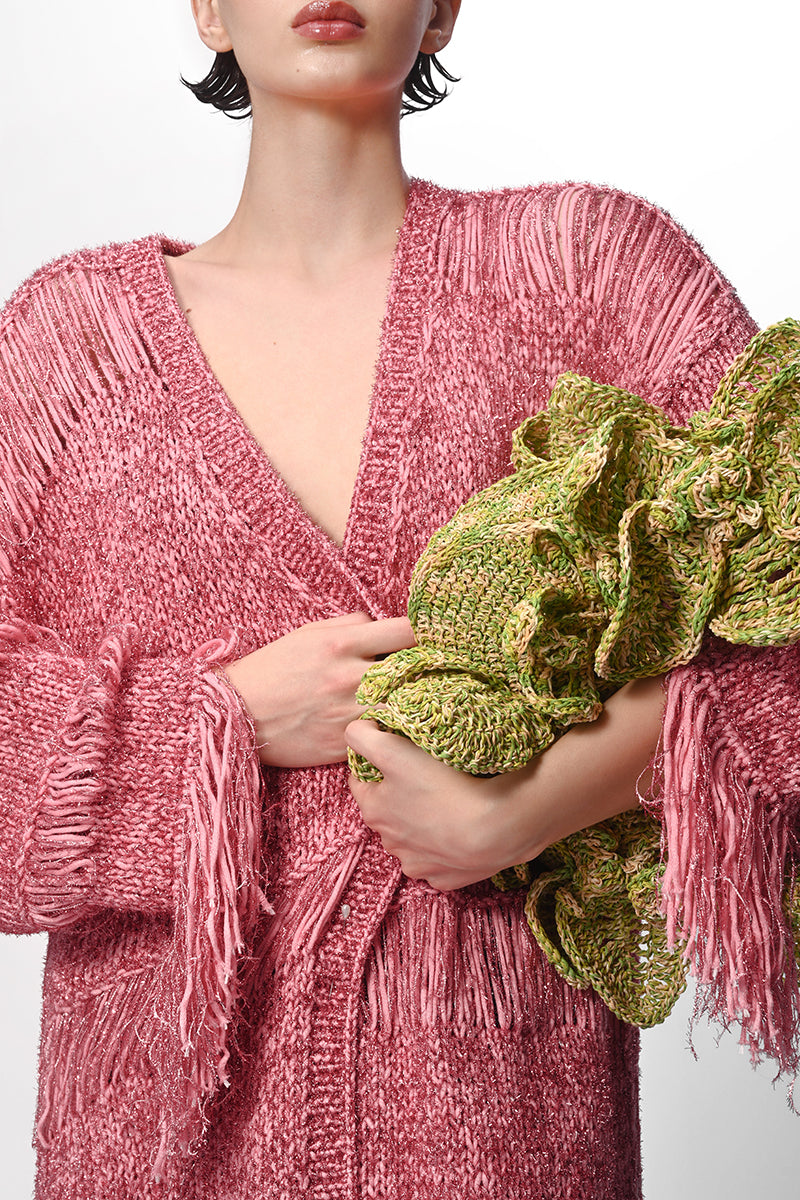 Pink metallic hand-knit coat by Lalo featuring a cozy, textured design perfect for stylish winter wear.