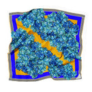 Elegant silk scarf by Amel Batita featuring intricate patterns, perfect for adding style to any outfit.