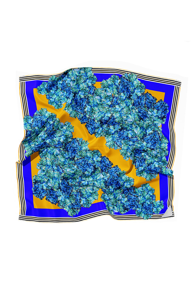 Silk LALUT scarf by Amel Batita featuring vibrant, intricate patterns, displayed flat with detailed fabric texture.
