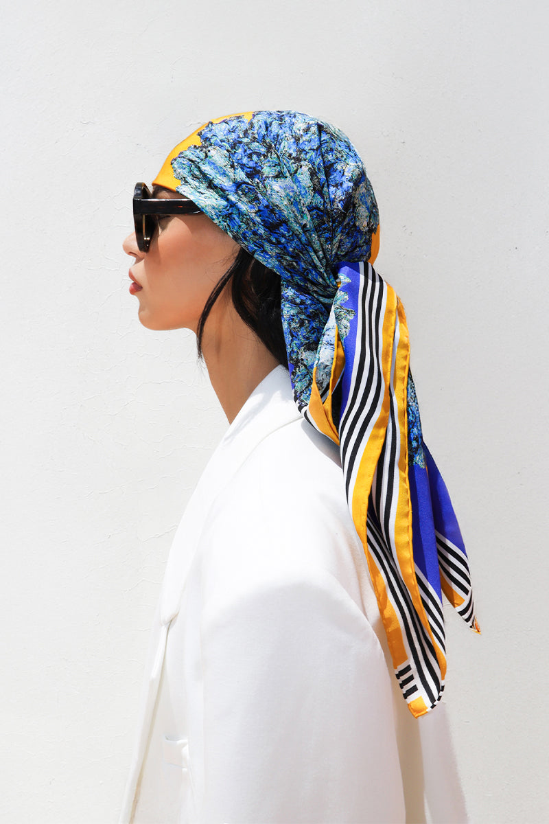 Silk LALUT scarf by Amel Batita featuring a 90cm bandana style design with vibrant patterns and soft fabric.