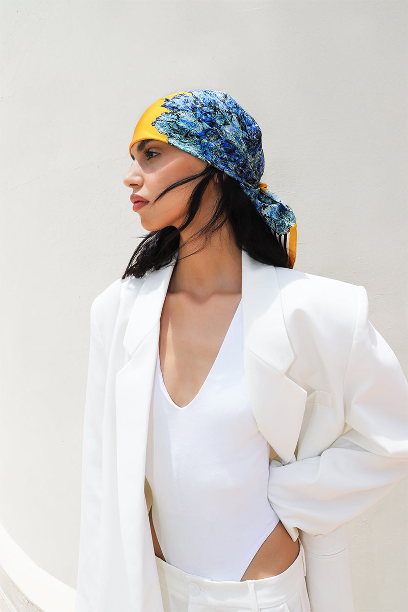 Silk LALUT scarf by Amel Batita featuring a 90cm bandana-style design with vibrant patterns and elegant texture.