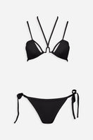 Black L’AMOUR bikini set by Maliluha with adjustable straps and classic triangle top on a flat lay.