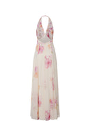 Beige floral Lana maxi dress by Nana Jacqueline with halter neckline and back detail, displayed on a hanger.