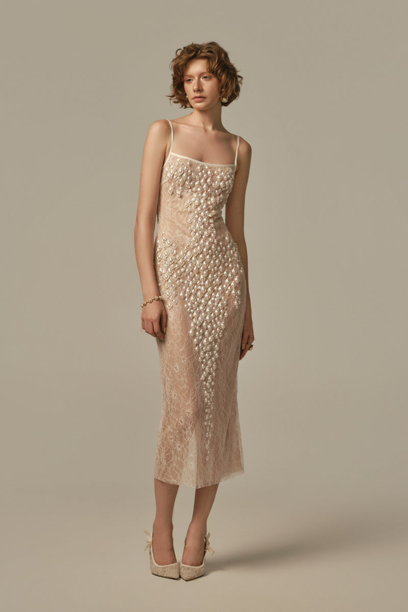 White POEM Larme midi dress on a model, showcasing a stylish and elegant midi dress design with a fitted silhouette.