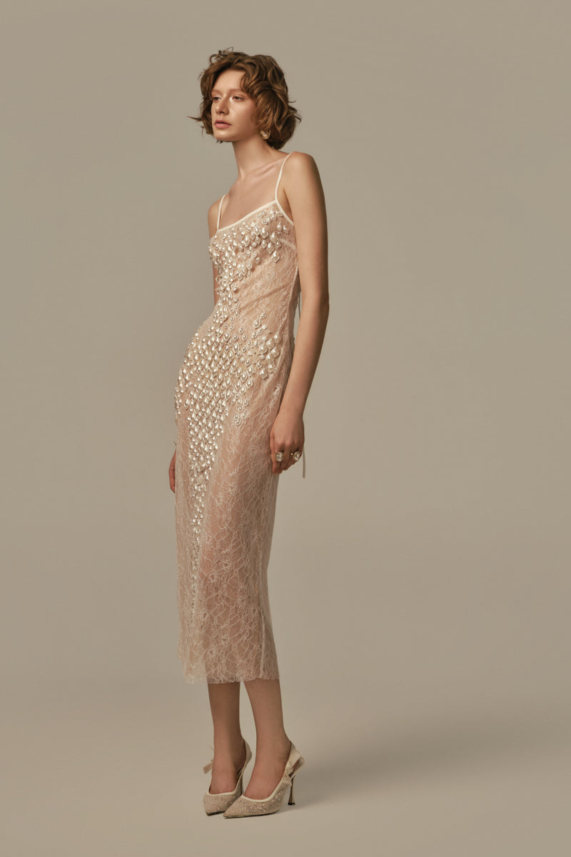White POEM LARME midi dress on model, showcasing elegant sleeveless design and flowing fabric perfect for stylish occasions.