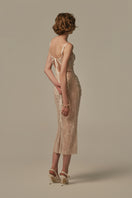 White POEM LARME midi dress on a model, showcasing a stylish, elegant midi-length dress with a fitted waist and flowy skirt.