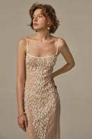 White POEM LARME midi dress worn by model, featuring a sleek, elegant design perfect for stylish occasions.