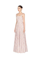 Lavender pleated maxi dress by Montsand, shown from the side, featuring flowing fabric and elegant pleats for a sophisticated look.