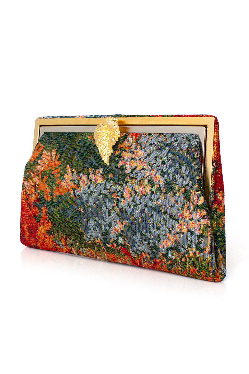 Multicolor Sarah's Bag Lean on Autumn Field Grace clutch with leaf pattern and elegant design, perfect for stylish occasions.