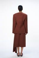 URA Leah blazer in rust color, tailored blazer for women with a structured fit, featuring lapels and front buttons.