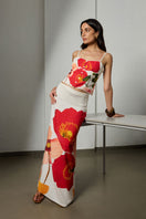 Maxi skirt in wild bouquet print by Summer Away, featuring flowy fabric and vibrant floral design, styled with a matching top.