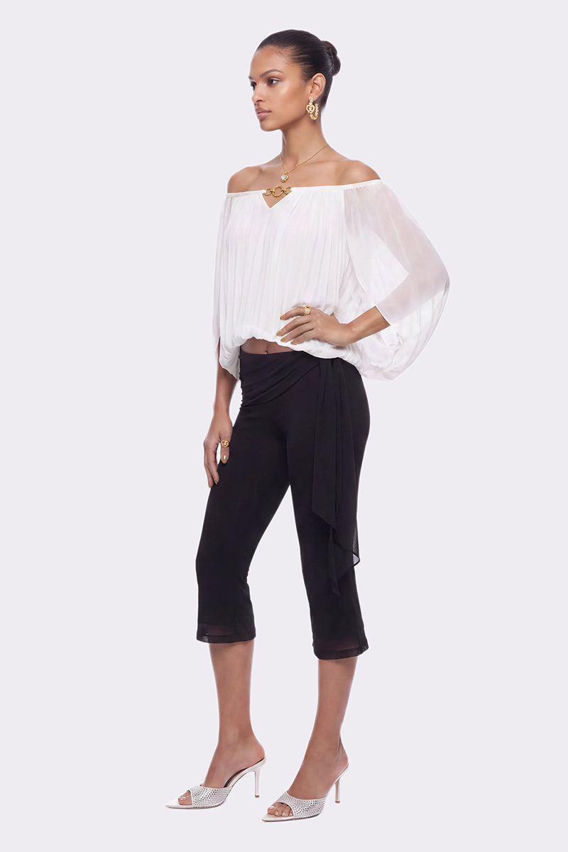 White Leona Top by Nana Jacqueline featuring a ring cutout design, shown on a model with a stylish, modern look.