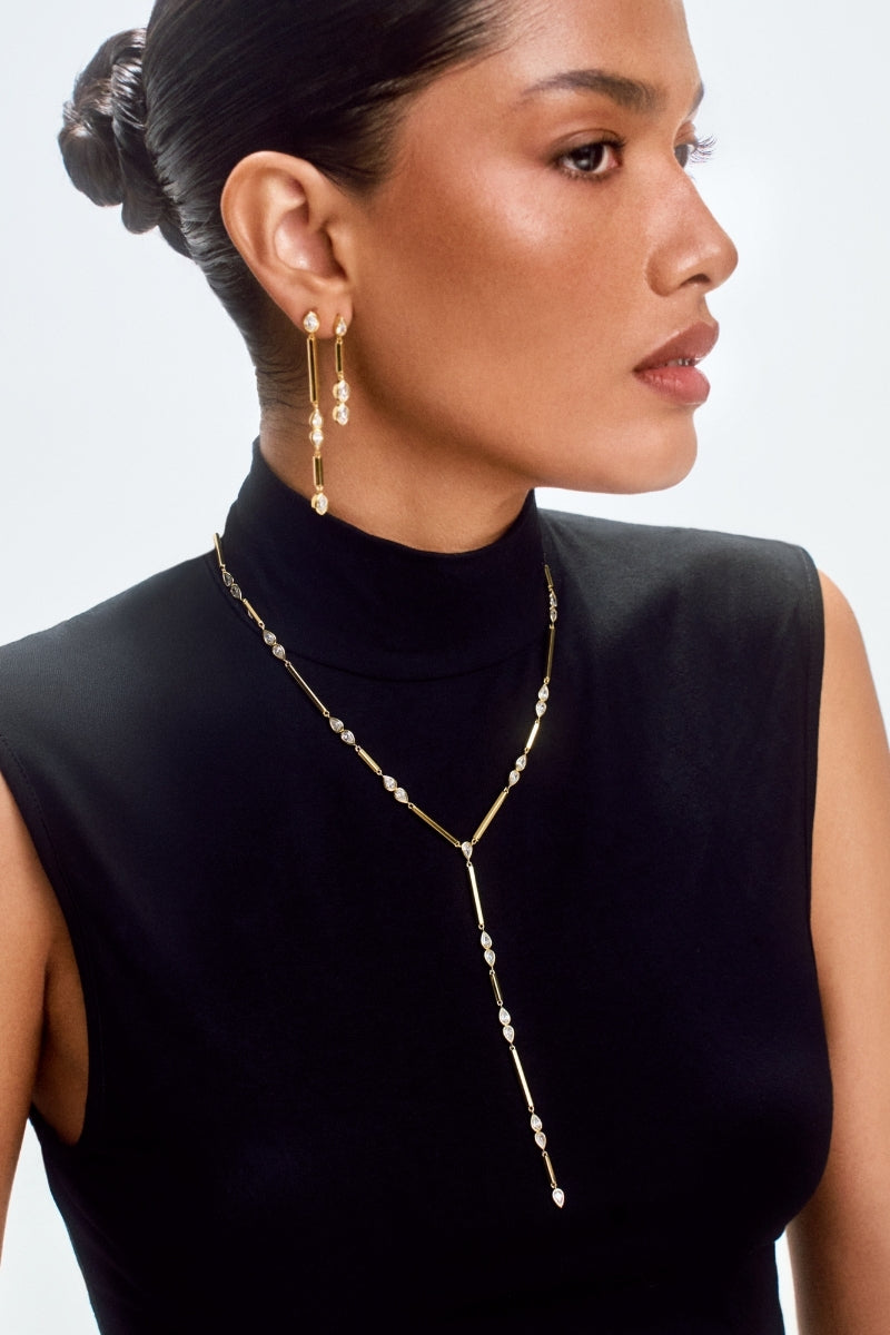 Small gold Lia HEX Drop Earrings by Velvet Desert, featuring geometric hexagon design, shiny metallic finish.
