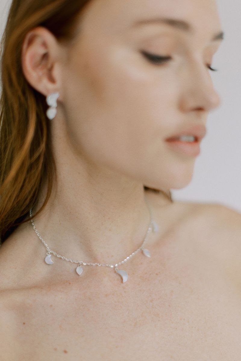 Silver petite moon necklace from Freya Rose's WARRIORESS collection, featuring a delicate moon pendant on a fine chain.