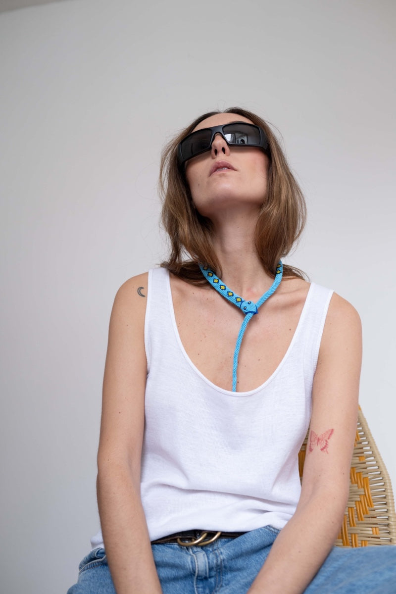 Light blue guardian snake necklace by Pájara Pinta, featuring a detailed snake pendant on a delicate chain.