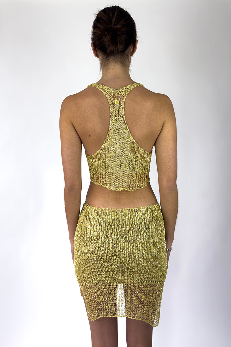 Light gold chain racerback bralette top by Natalia Fedner, featuring a sleek design and delicate chain details.