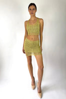 Light gold chain racerback crop top with bralette by Natalia Fedner, featuring a stylish chain design and modern fit.