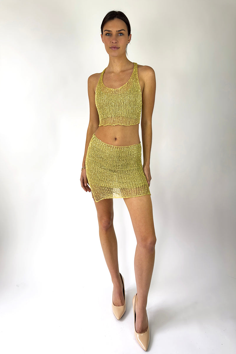 Light gold chain racerback crop top with bralette by Natalia Fedner, featuring a stylish chain design and modern fit.