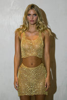 Light gold chain racerback crop top with built-in bralette by Natalia Fedner, featuring a sleek, modern design and elegant metallic details.