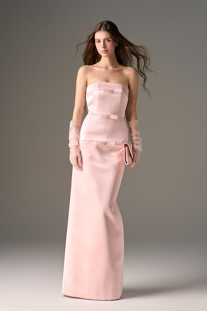 Light pink taffeta maxi gown with crystal embellishments by I.H.F Studio featuring a sleek column design.
