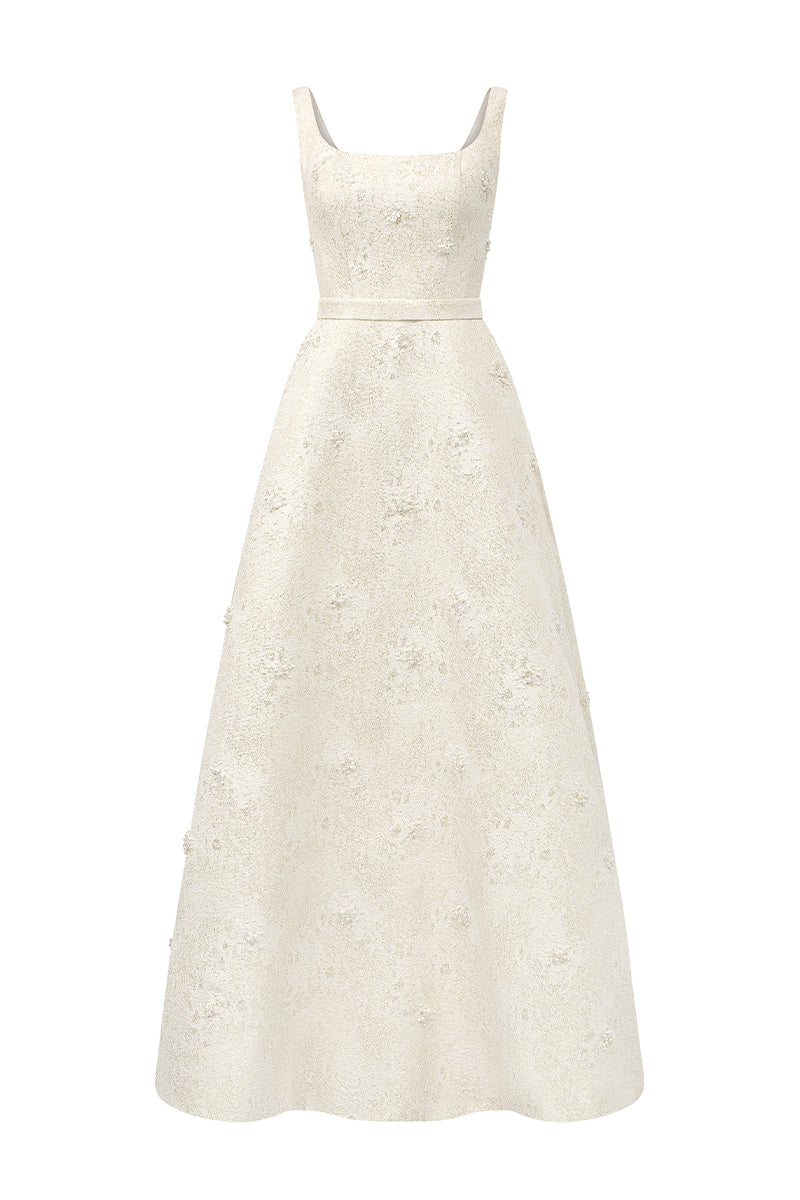 Light yellow silk-lined brocade strapless A-line gown with lacquered finish and pearl cluster embellishment by I.H.F Studio.
