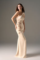 Beige one-shoulder taffeta gown with rosette detail by I.H.F Studio, featuring a flowing maxi dress design.