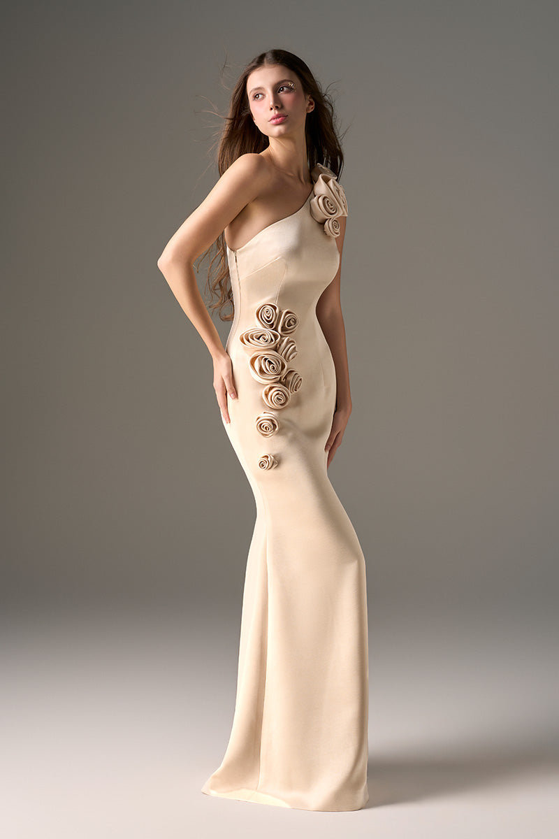 Beige one-shoulder taffeta gown with rosette detail by I.H.F Studio, featuring a flowing maxi dress design.