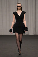 Lili Blanc luxe tailored sleeveless midi dress in elegant fabric, featuring a fitted bodice and flowing skirt.