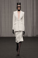 Lili Blanc classic midi length pencil skirt in neutral fabric, shown on model with side slit and fitted waist design.