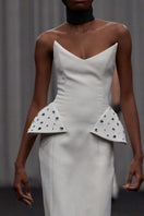 Elegant strapless structured gown by Lili Blanc with a fitted bodice and flowing skirt, perfect for formal occasions.