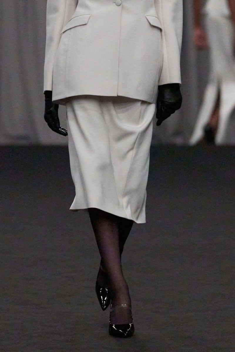 Lili Blanc classic midi length pencil skirt in a sleek design, perfect for professional or casual wear.