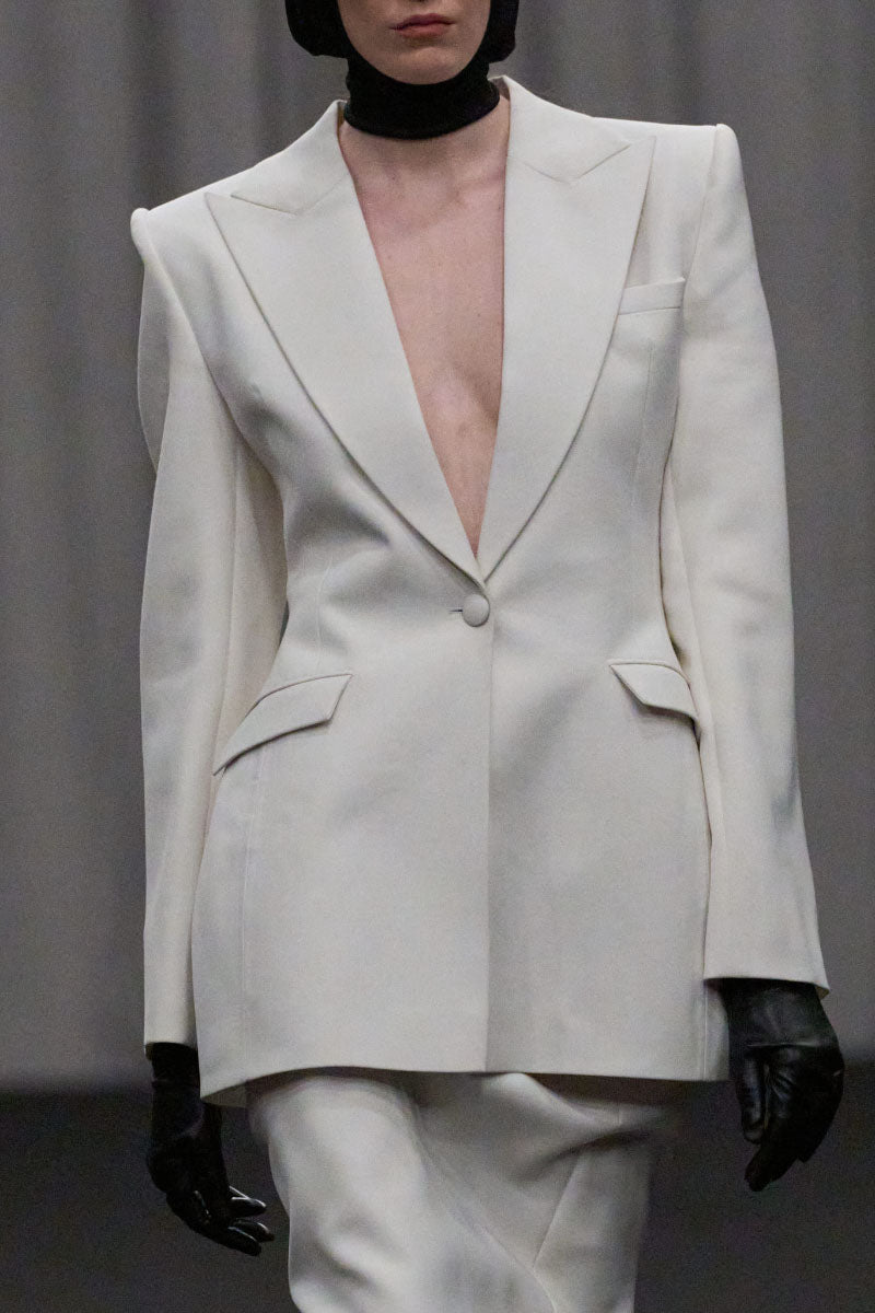 Lili Blanc sleek single-breasted blazer in classic design, shown in black with tailored fit and structured lapels.