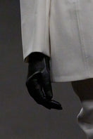 Lili Blanc sleek single-breasted blazer in a tailored fit, shown on a mannequin with a classic lapel and button closure.
