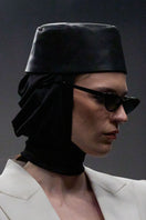 Lili Blanc sleek single-breasted blazer in tailored fabric, featuring a classic collar and button closure, displayed on a hanger.