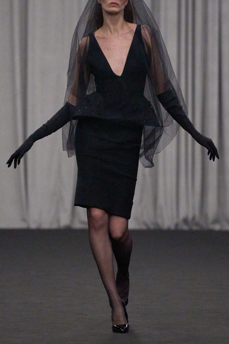 Lili Blanc sleeveless tailored midi dress with a sophisticated fit, perfect for elegant occasions, shown on a model.