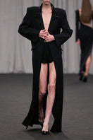 Lili Blanc oversized tailored coat in neutral fabric, shown on a hanger with detailed lapels and structured design.
