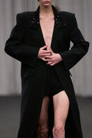 Lili Blanc oversized tailored coat in a luxurious fabric, featuring a structured design with wide lapels and a sleek silhouette.