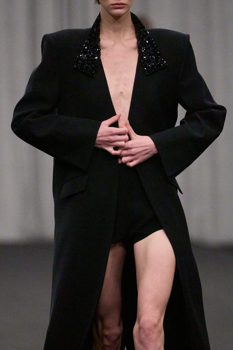 Lili Blanc oversized tailored coat in a luxurious fabric, featuring a structured design with wide lapels and a sleek silhouette.