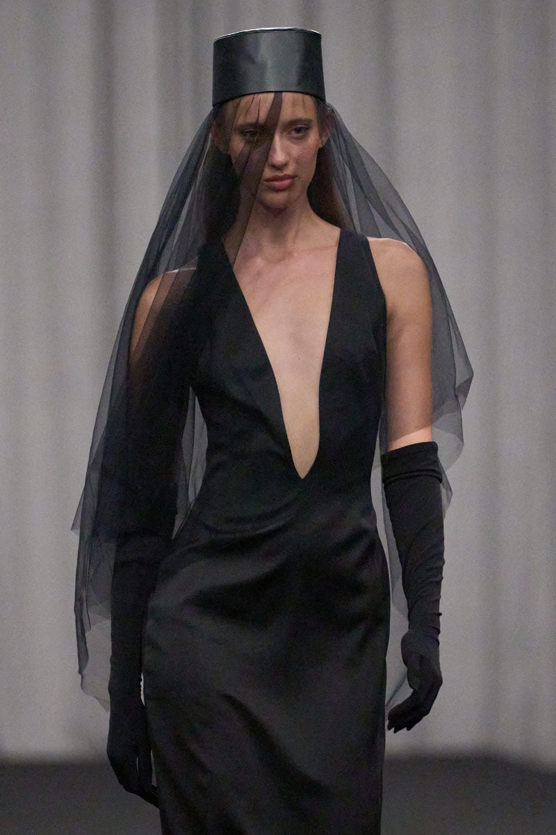 Lili Blanc fitted sleeveless gown with elegant design, showcasing a sleek silhouette and stylish neckline.