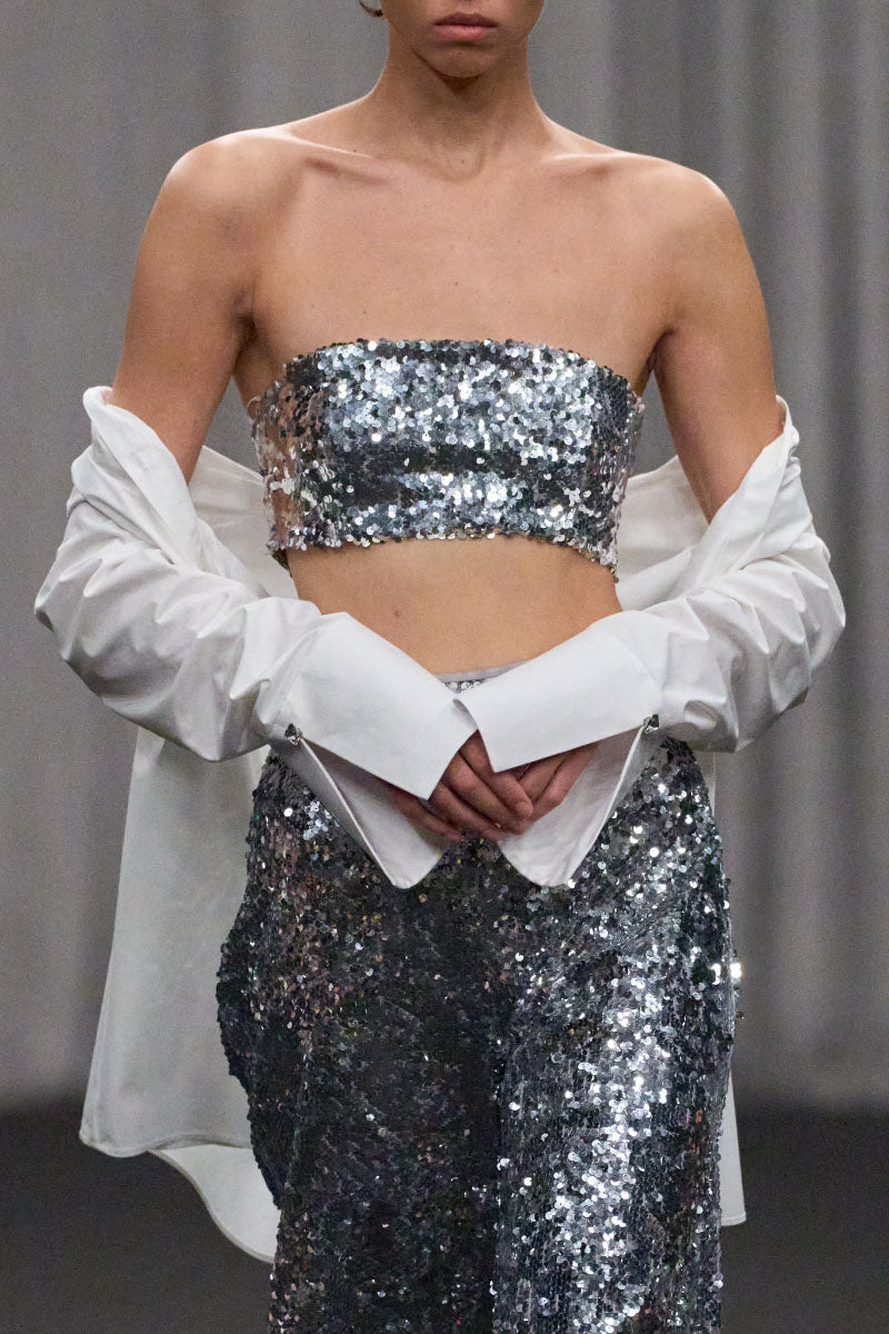 Lili Blanc sequin fitted crop top with shimmering sequins, short sleeves, and a stylish, form-fitting design.
