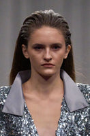Lili Blanc sequin longline coat featuring shimmering sequins and a sleek silhouette, stylishly displayed on a hanger.