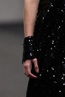 Lili Blanc glamorous sleeveless sequin gown featuring a fitted silhouette and elegant design, perfect for formal events.