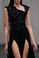 Lili Blanc asymmetric sleeveless jumpsuit with a fitted bodice and wide-leg pants, stylish and elegant for modern fashion.