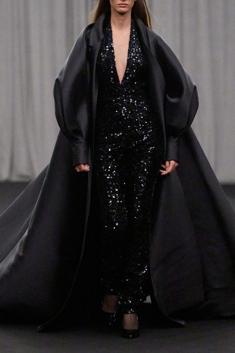Lili Blanc fluid longline overcoat in neutral fabric, tailored coat with a sleek silhouette and classic lapel collar.