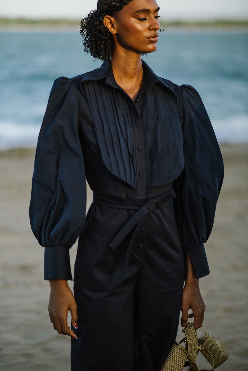 Navy blue Lilianne jumpsuit by ANA + MARIA, featuring a stylish, fitted design with wide legs and a sleeveless top.