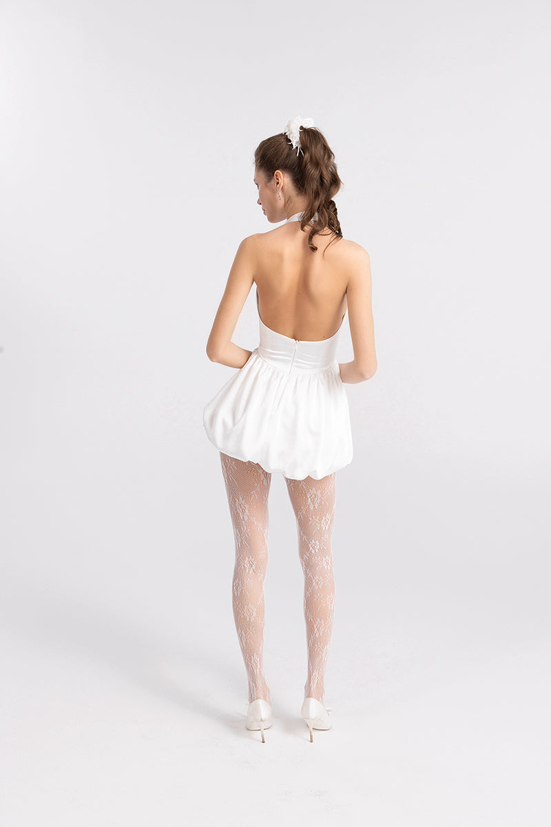 White LILLANA HALTER MINI DRESS by Nana Jacqueline, stylish sleeveless dress with halter neckline displayed on a model.