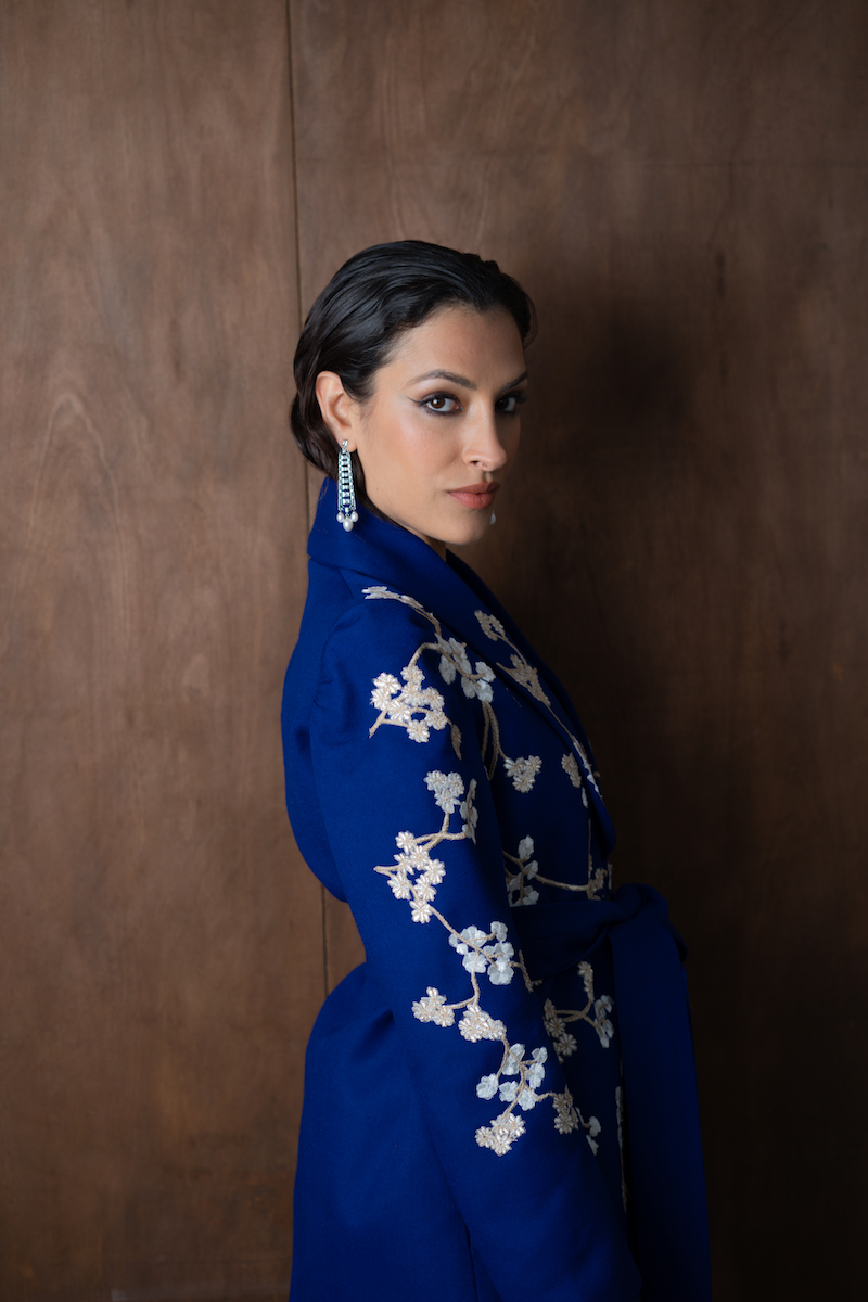 Nadya Shah Lily Fleur de Cerisier jacket featuring a floral pattern and lightweight design, displayed on a hanger.