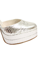 Silver platform heels by Terry de Havilland featuring a sleek design with chunky heels and stylish strappy details.