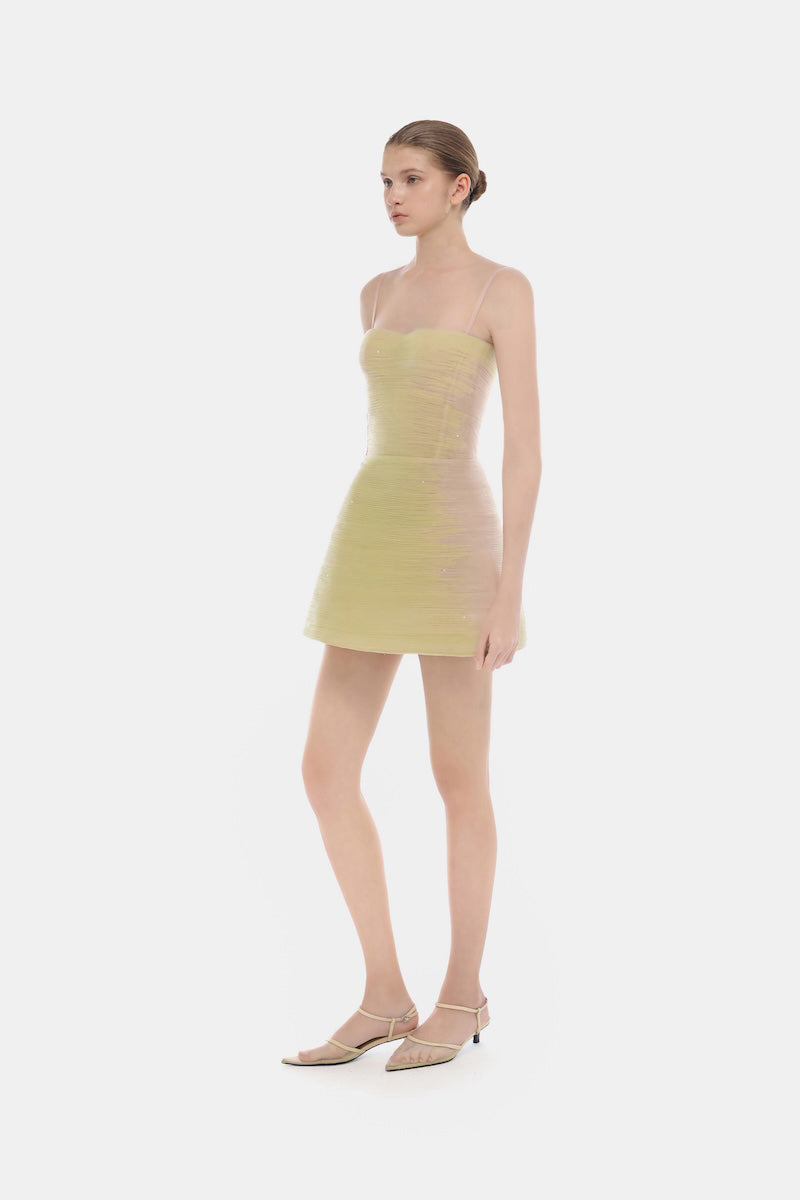 Lime crinkled mini dress by Montsand, showcasing a fitted silhouette and textured fabric, perfect for casual or summer wear.